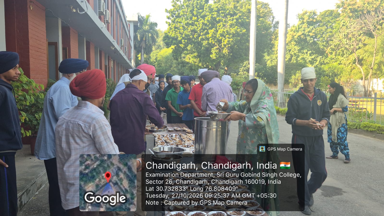 Staff members serving parshad